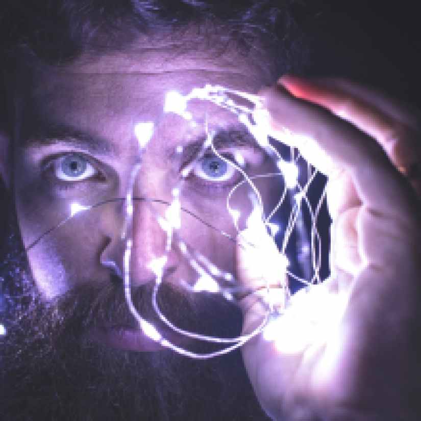 person holding string lights photo